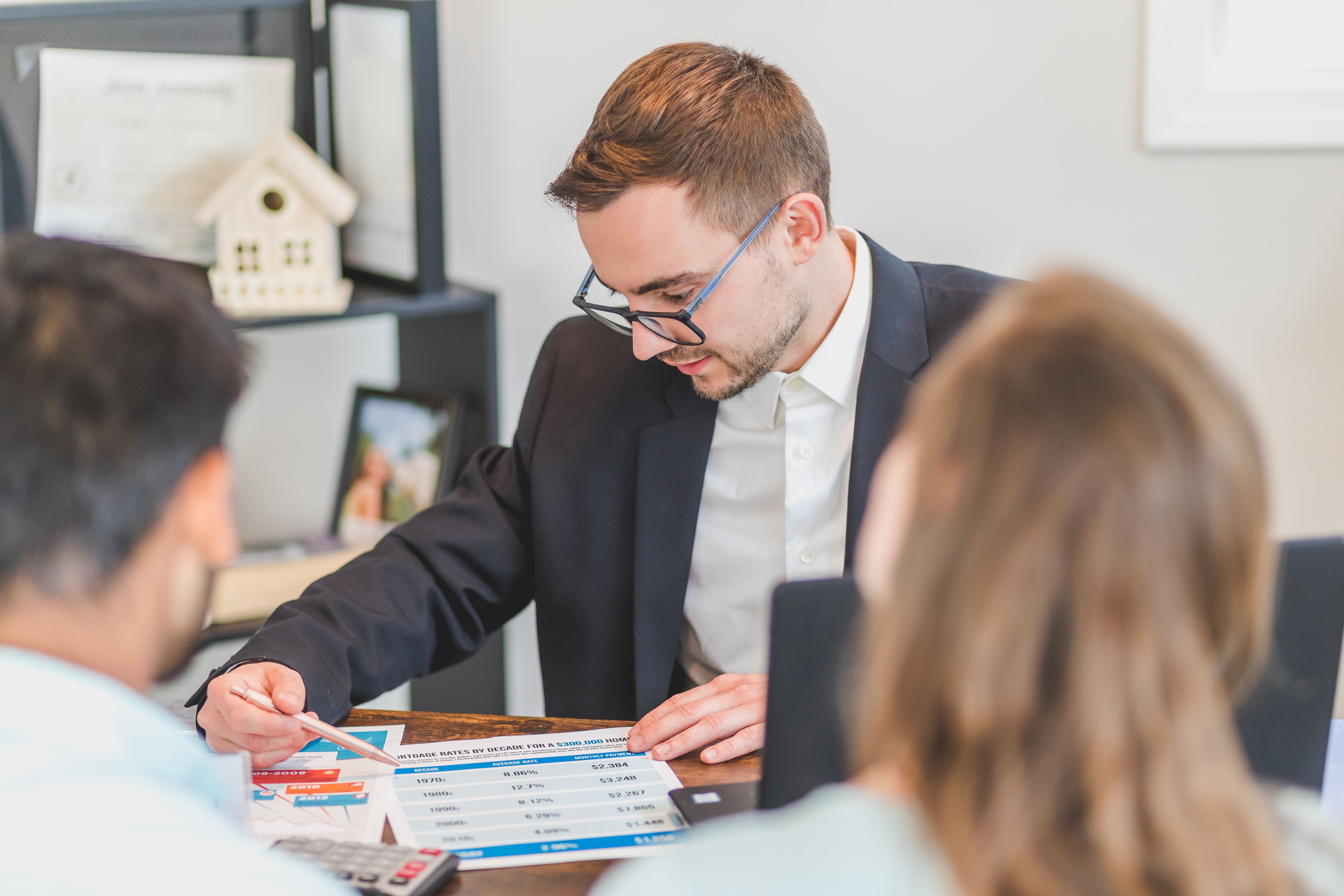 Property manager reviewing rental numbers with homeowners